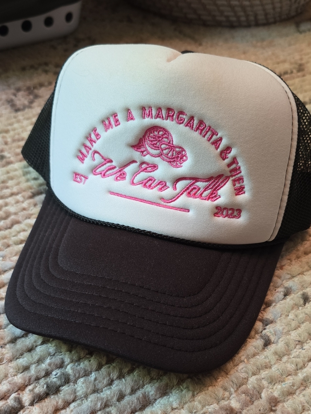 White & Black Trucker Hat with Pink Embroidered Slogan